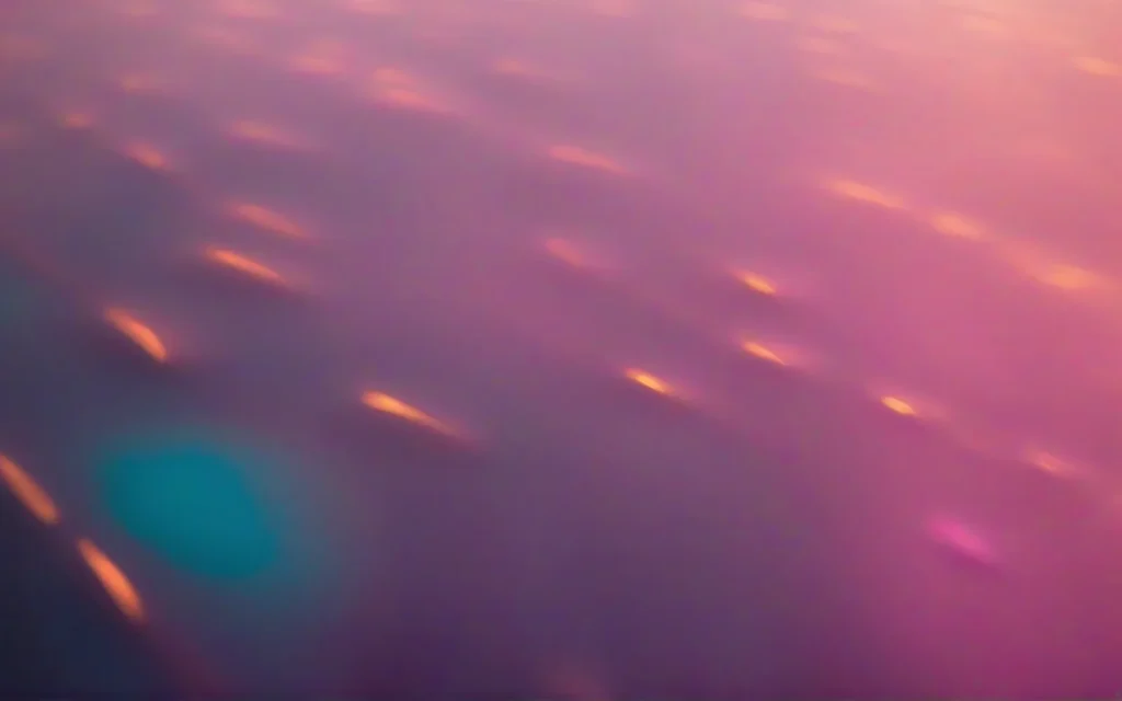 Abstract photograph of soft warm pools of light receding rhythmically into darkness
